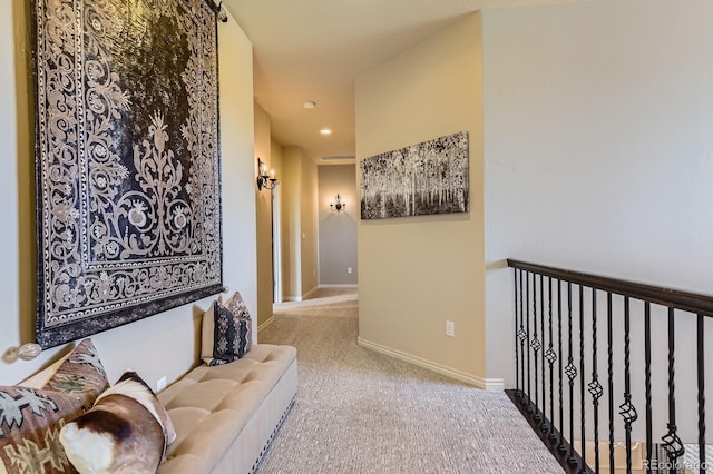 hallway featuring carpet, recessed lighting, and baseboards