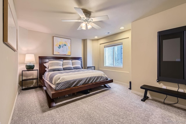 carpeted bedroom featuring baseboards and ceiling fan