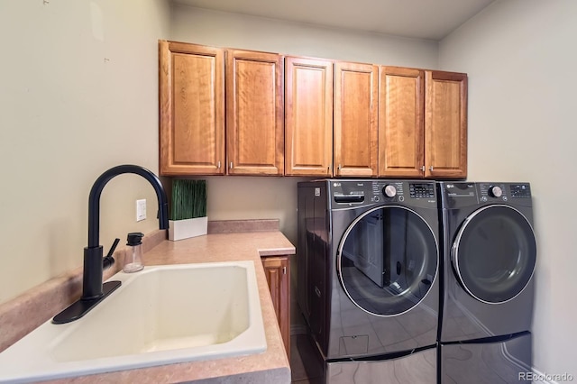washroom featuring cabinet space and washer and dryer