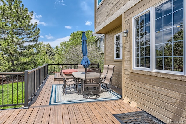 wooden deck with outdoor dining space