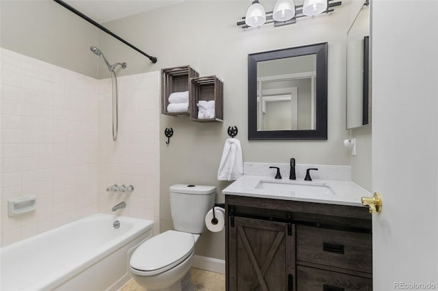 bathroom with shower / washtub combination, vanity, toilet, and baseboards