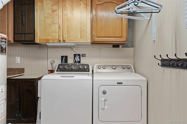 laundry room featuring cabinet space and separate washer and dryer