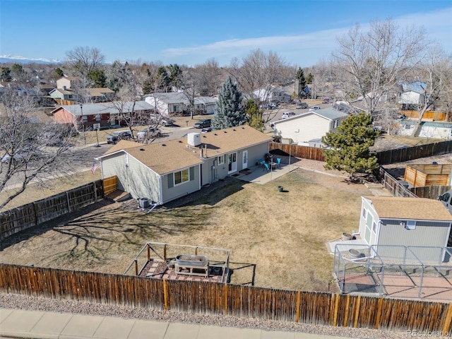 birds eye view of property with a residential view