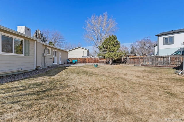 view of yard with a fenced backyard