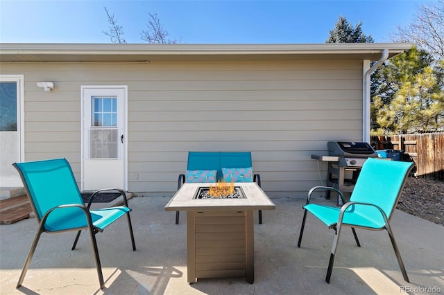 view of patio / terrace featuring a fire pit, a grill, and fence