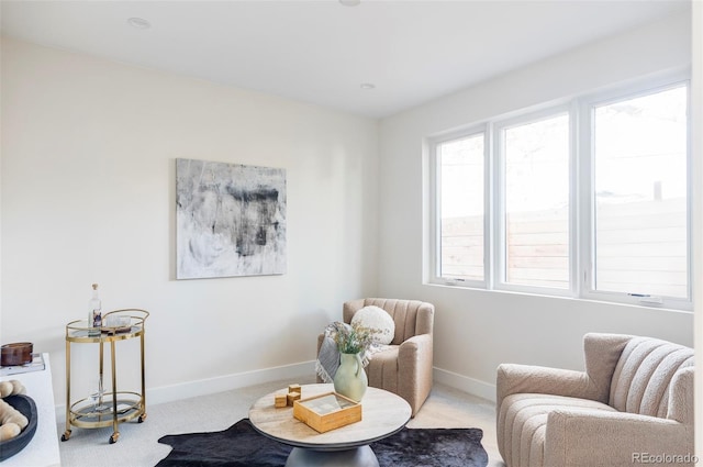 sitting room with light colored carpet