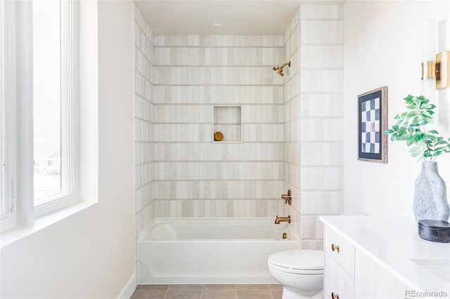 full bathroom featuring tile patterned floors, vanity, bathtub / shower combination, and toilet