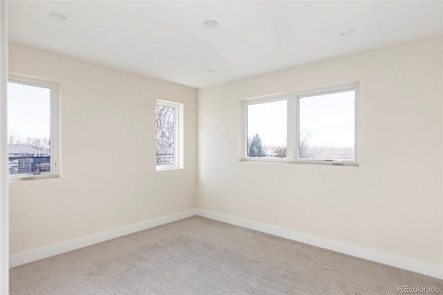 empty room featuring light colored carpet