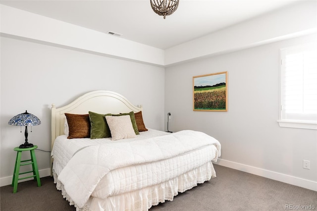 bedroom with carpet flooring, baseboards, and visible vents