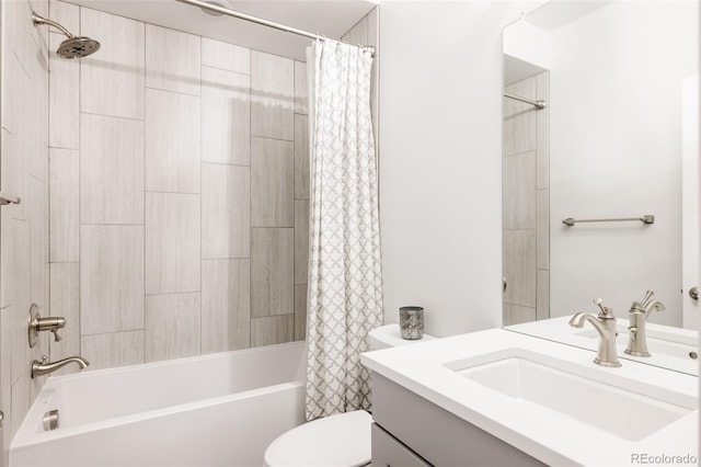 full bathroom with shower / tub combo with curtain, vanity, and toilet