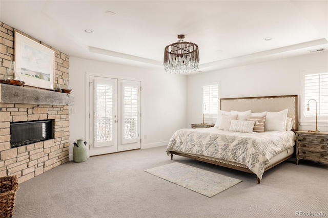 bedroom featuring access to exterior, multiple windows, french doors, and visible vents