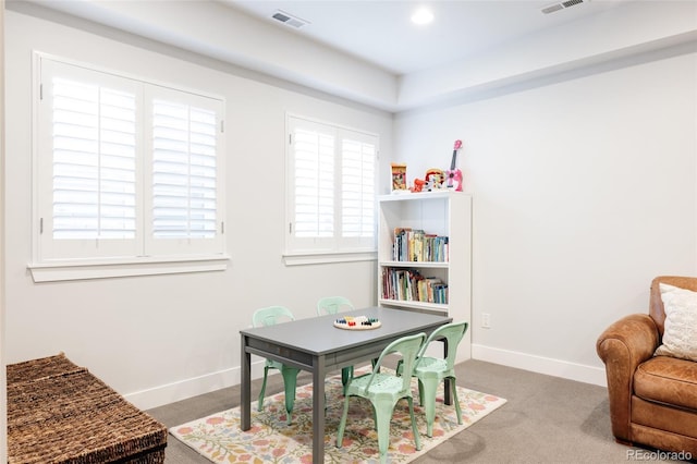 recreation room with carpet, baseboards, and visible vents