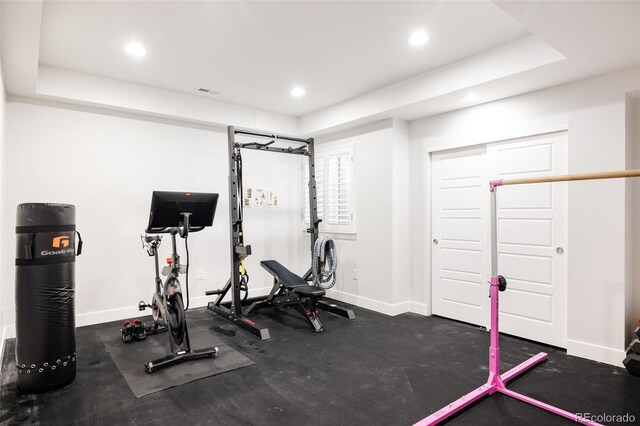 exercise area with recessed lighting and baseboards