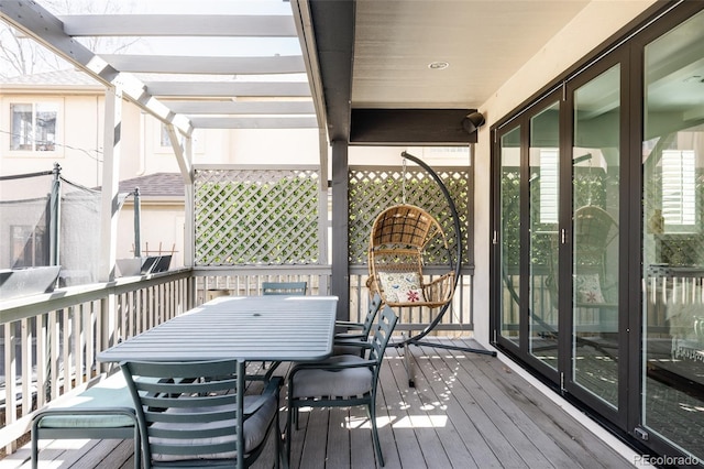 deck with outdoor dining area