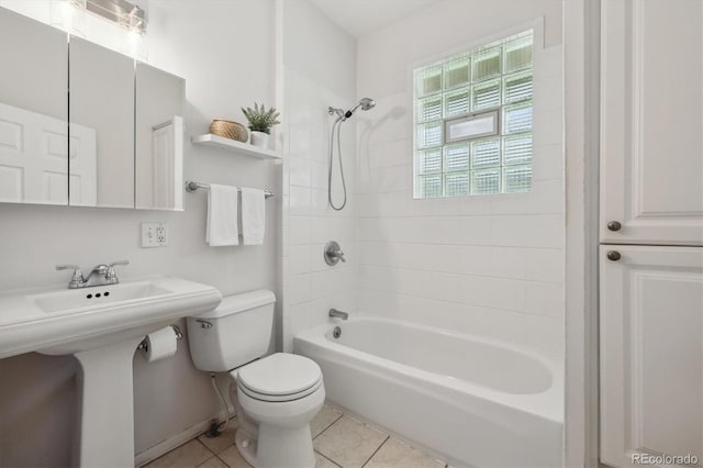 full bathroom featuring toilet, tile patterned floors, shower / bath combination, and a sink