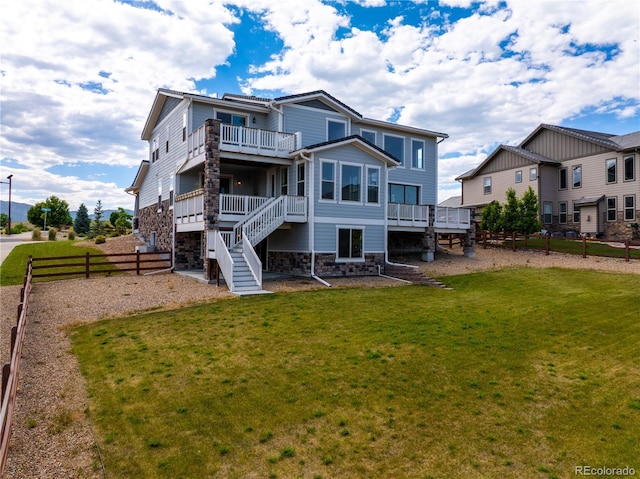9566 Poppy Way, Arvada, CO 80007 - rear view of property with stone siding, stairs, and a deck