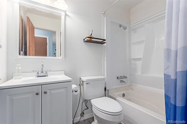 bathroom featuring vanity, toilet, and shower / bath combo with shower curtain