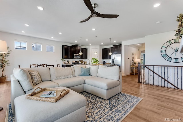 11817 Phoebe St, Parker, CO 80134 - living area featuring a ceiling fan, recessed lighting, and light wood-style flooring