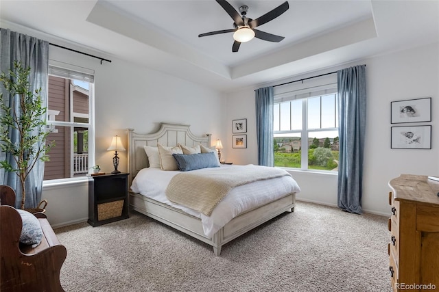11817 Phoebe St, Parker, CO 80134 - carpeted bedroom with a tray ceiling and a ceiling fan