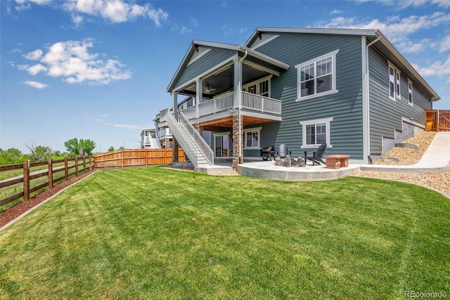11817 Phoebe St, Parker, CO 80134 - rear view of property with a fenced backyard, a patio, a fire pit, stairway, and a deck