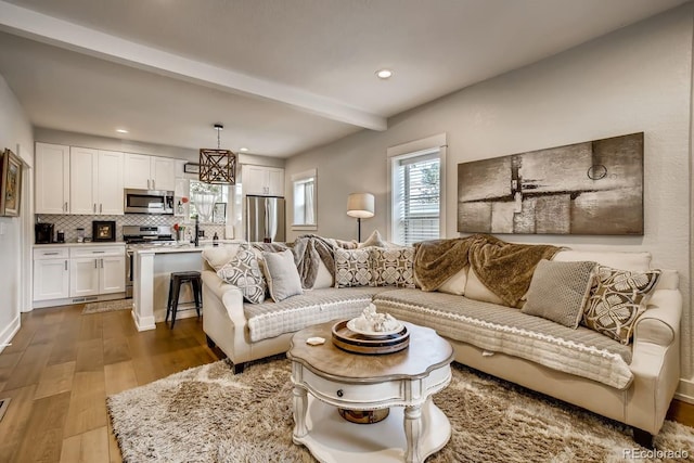 5123 W 41st Ave, Denver, CO 80212 - living room featuring dark wood finished floors, recessed lighting, and beamed ceiling