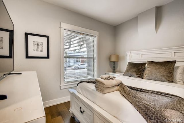 5123 W 41st Ave, Denver, CO 80212 - bedroom featuring dark wood-style flooring and multiple windows
