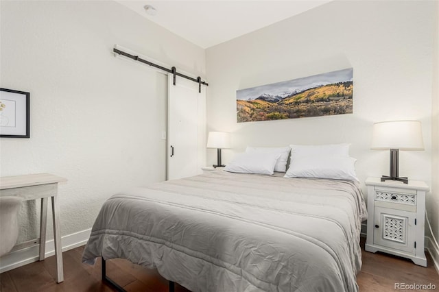 5123 W 41st Ave, Denver, CO 80212 - bedroom with a barn door and wood finished floors