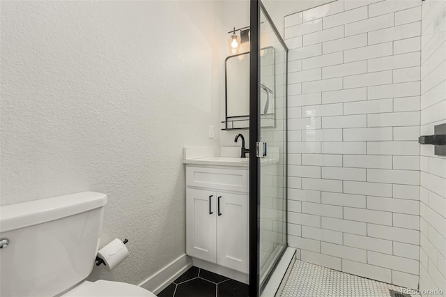 5123 W 41st Ave, Denver, CO 80212 - full bath with vanity, a stall shower, tile patterned flooring, and a textured wall