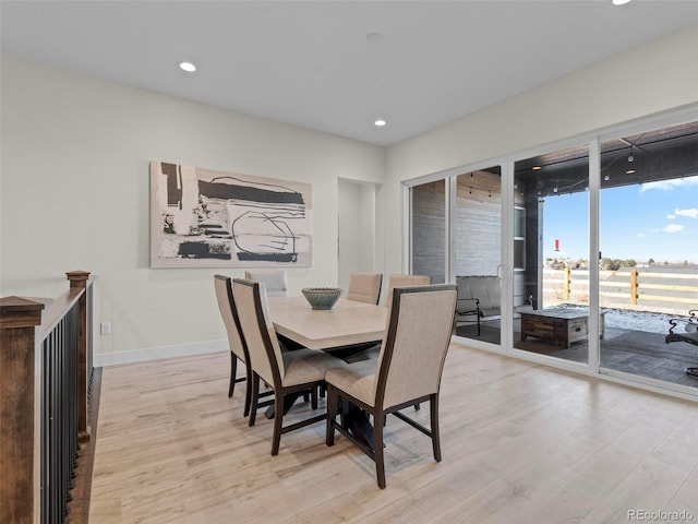 dining area with light hardwood / wood-style floors