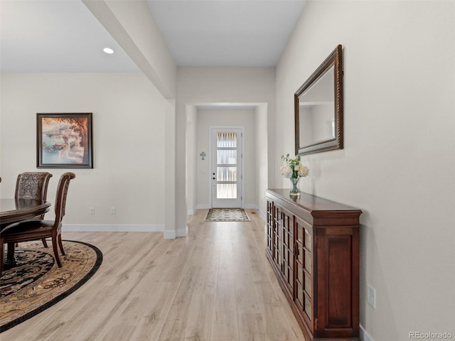 foyer entrance with light hardwood / wood-style floors