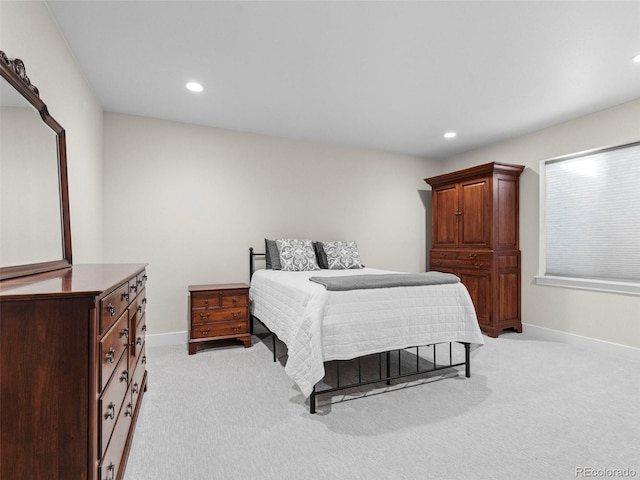 bedroom featuring light colored carpet