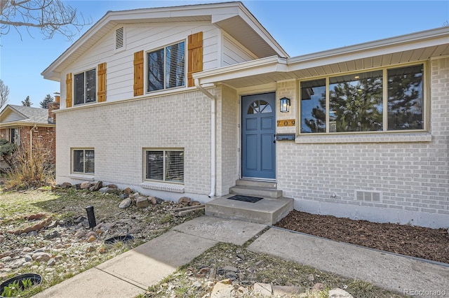 exterior space featuring brick siding and entry steps