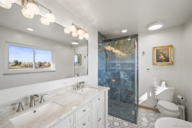 bathroom with toilet, recessed lighting, a marble finish shower, and a sink