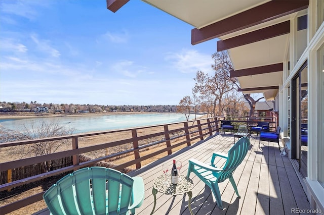 wooden deck with a water view