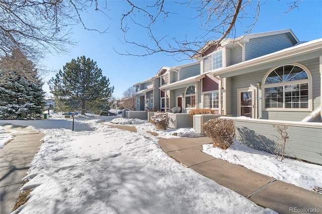 view of snow covered property