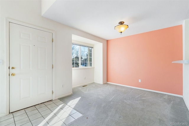 foyer entrance featuring light tile patterned flooring