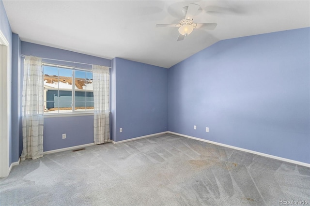 unfurnished room featuring vaulted ceiling, carpet floors, and ceiling fan