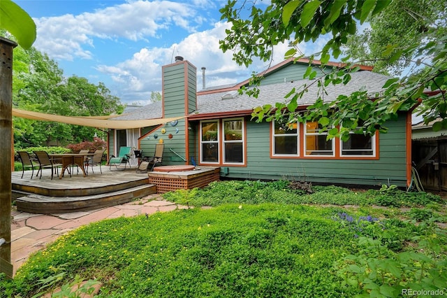 3982 Arbol Ct, Boulder, CO 80301 - rear view of house with a deck, a chimney, outdoor dining area, and a shingled roof