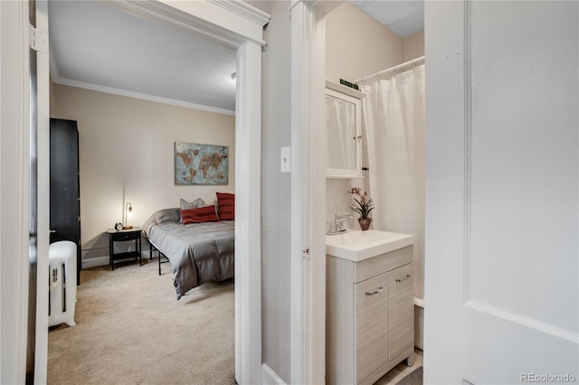 bedroom with light carpet, sink, and crown molding