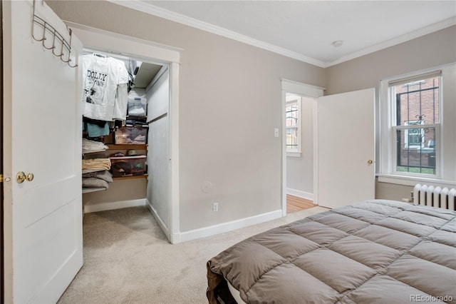 bedroom with light colored carpet, crown molding, and radiator