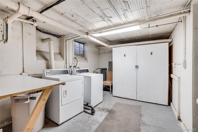 clothes washing area featuring washer and clothes dryer