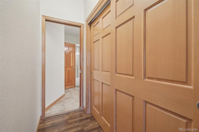 corridor featuring dark hardwood / wood-style floors