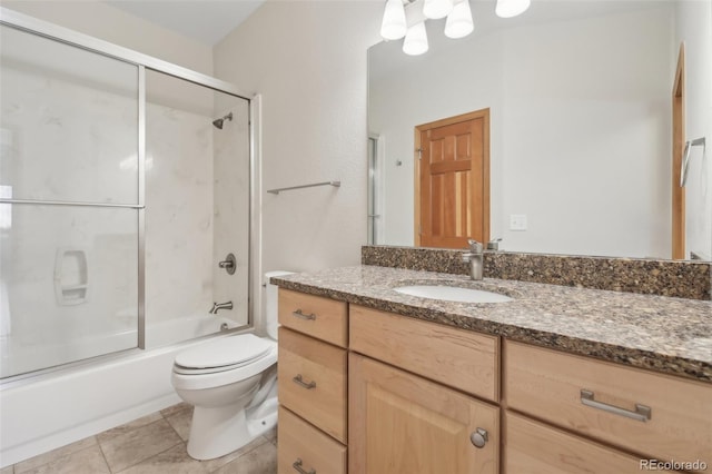 full bathroom with tile patterned floors, vanity, toilet, and enclosed tub / shower combo