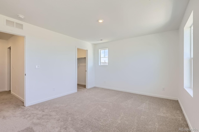 22094 E 39th Pl, Aurora, CO 80019 - empty room with light colored carpet and recessed lighting