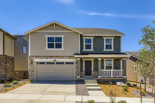 22094 E 39th Pl, Aurora, CO 80019 - view of front facade with a porch, a garage, driveway, and stone siding