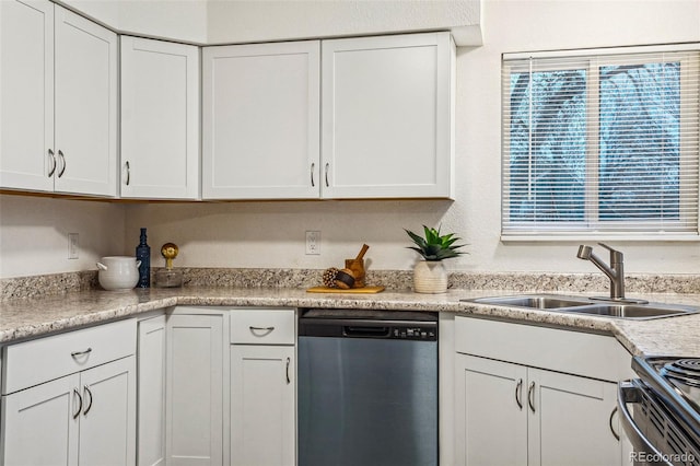 kitchen with range with electric cooktop, a sink, white cabinets, light countertops, and stainless steel dishwasher