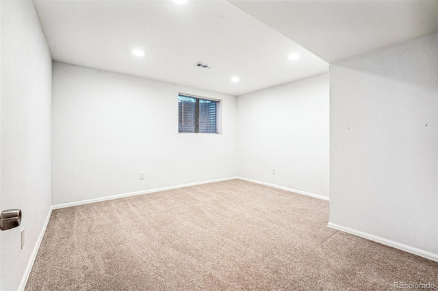 spare room with baseboards, carpet flooring, visible vents, and recessed lighting