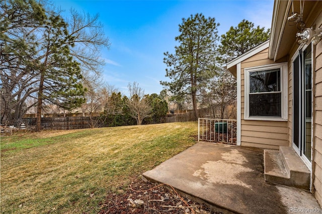 view of yard featuring a patio and fence