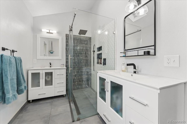 3765 E Easter Dr, Centennial, CO 80122 - bathroom featuring a stall shower, tile patterned floors, and two vanities