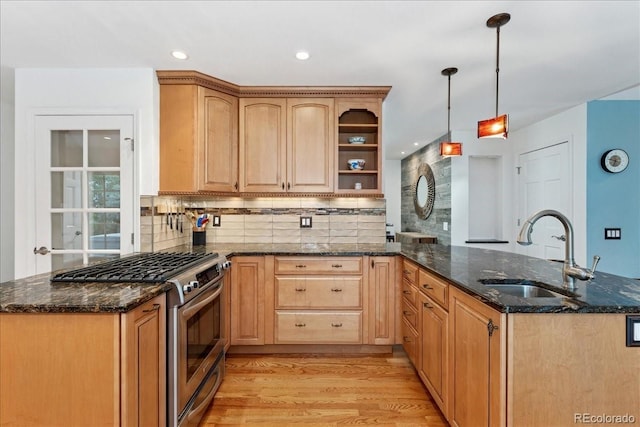 3765 E Easter Dr, Centennial, CO 80122 - kitchen with stainless steel gas stove, a peninsula, light wood-style floors, light brown cabinetry, and backsplash